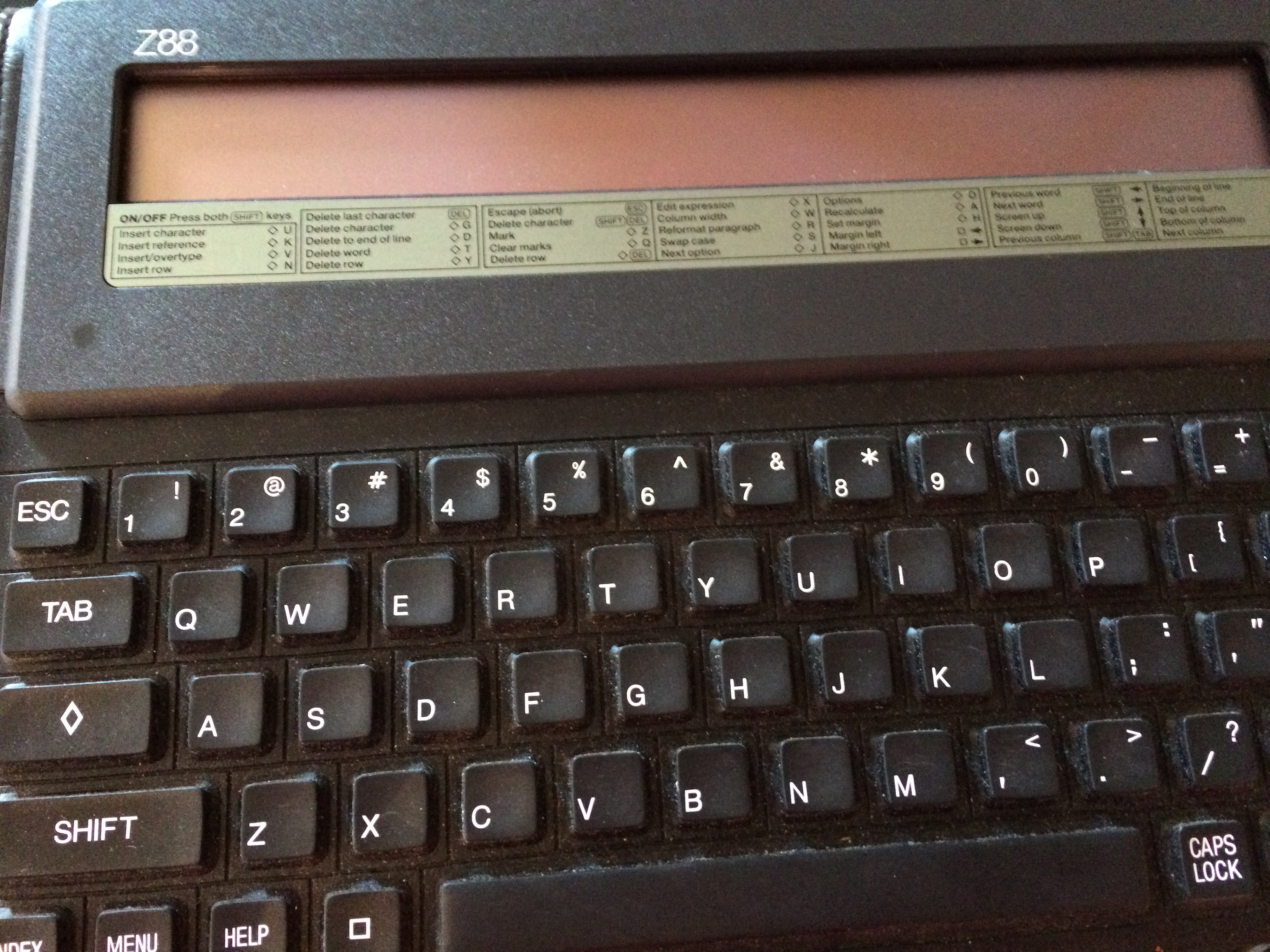 Close-up of the Cambridge Z88 writing computer keyboard and its command reference strip